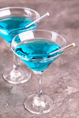 Two glasses of trendy blue wine with paper straws