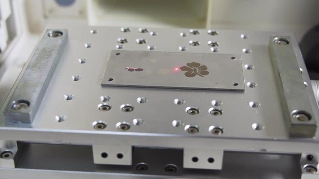 MOPA fiber laser machine engraving on a metal plate, gimbal shot