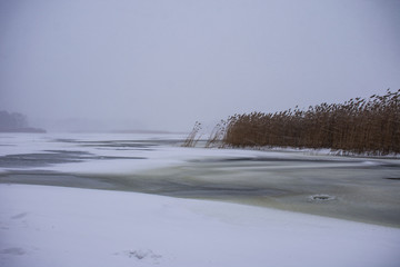 Winter landscape on the frozen river