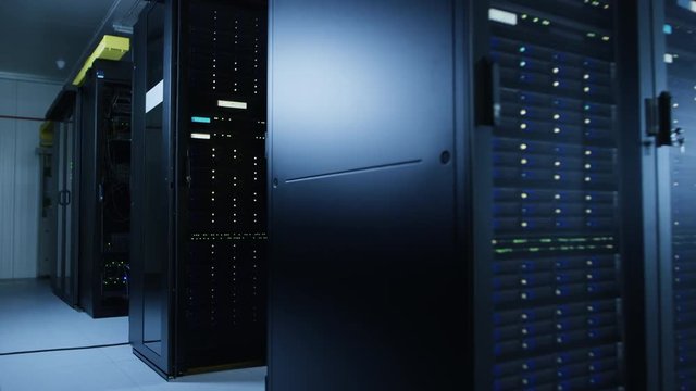 Moving Shot of Data Center With Multiple Rows of Fully Operational Server Racks. Modern Telecommunications, Cloud Computing, Artificial Intelligence, Database, Supercomputer Technology Concept.