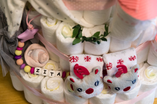 Detail of nappy cake and reindeer socks and Zita's name.