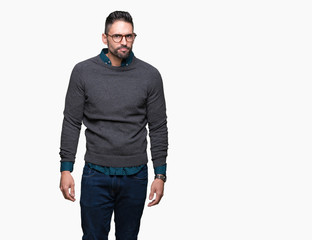 Fototapeta premium Young handsome man wearing glasses over isolated background skeptic and nervous, frowning upset because of problem. Negative person.