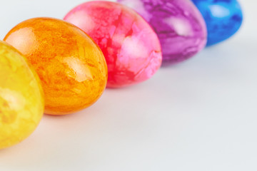Colored Easter eggs on white background.