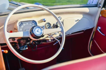 Deurstickers Vintage retro car interior with wheel and dashboard © o1559kip