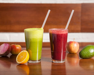 Vegan food, fruit juices - Colourful mixed drinks, beautifully arranged and surved on a wooden table	