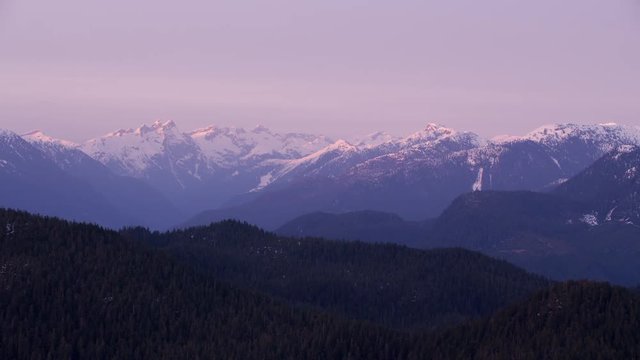 British Columbia, Canada circa-2018. Aerial view of snow covered mountain range.  Shot from helicopter with Cineflex gimbal and RED Epic-W camera.