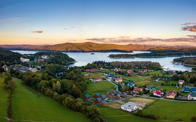 Sunset over Solina lake and Polanczyk village in Bieszczady mountains