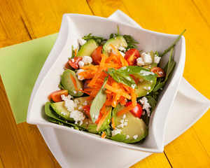 Fresh mixed salad - Close up of colorful cobb mixed salad, beautifully arranged and served on a white plate