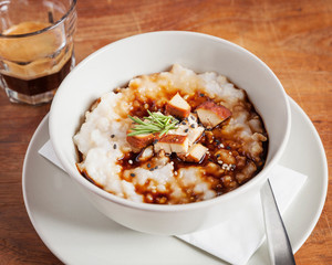 Asian food, dessert - Spicy rice soup beautifully arranged on a wooden table	