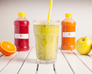 Vegan food, fruit juices - Colourful mixed drinks, beautifully arranged and surved on a white wooden table	