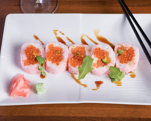 Top down view of fresh molecular maki rolls, beautifully arranged on a white plate