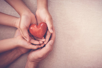 hands holding red heart, health insurance, organ donor day, donate volunteer charity giving , foster care, hope, gratitude, kind, thankful , csr social responsibility, all lives matter, no to racism - obrazy, fototapety, plakaty