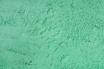 pretty vintage teal, sea-green stone like plaster texture for background use.
