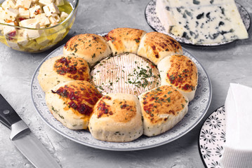 cheesecake and other types of cheese on gray marbled background