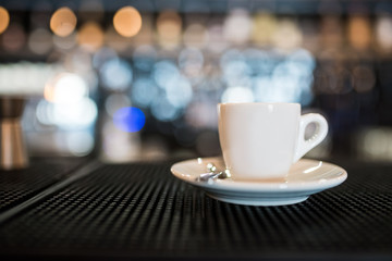 A cup of coffee on the bar table