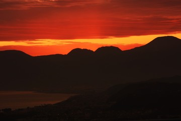 Afterglow of the sunset and silhouette of the mountains