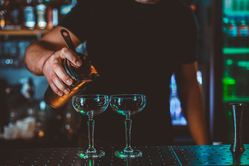 Cocktail Preparation. The barman is preparing a drink.