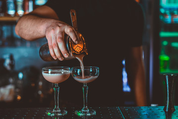 Cocktail Preparation. The barman is preparing a drink.
