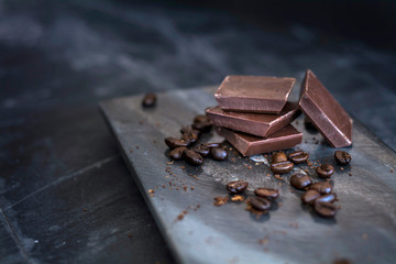 milk chocolate and coffee beans in kitchen for dessert making