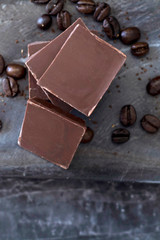 milk chocolate and coffee beans in kitchen for dessert making