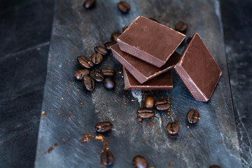milk chocolate and coffee beans in kitchen for dessert making