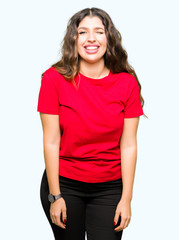 Fototapeta premium Young beautiful woman wearing casual t-shirt winking looking at the camera with sexy expression, cheerful and happy face.