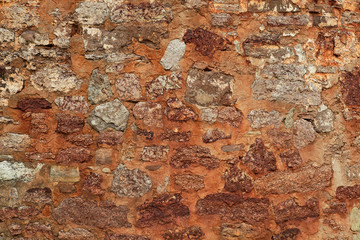 Image patch of original wall of 14-th century with bricks of shell rocks, background texture close up