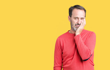 Handsome middle age hoary senior man wearing winter sweater over isolated background thinking looking tired and bored with depression problems with crossed arms.
