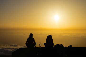 Fototapeta na wymiar Silhouette two women watching the sunset