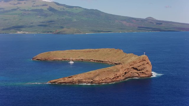 Maui, Hawaii circa-2018.  Aerial view of Molokini Crater off the coast of Maui.  Shot with Cineflex and RED Epic-W Helium. 