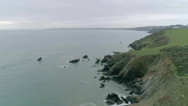 Vast aerial tracking over the stunning wild South Devon Coastline from the inner combe rocks, just south of Dartmouth.