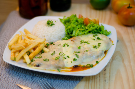 Bife &agrave; parmegiana