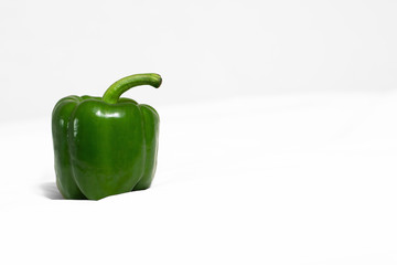green pepper on white background