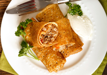 Crepes stuffed with meat and rice