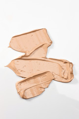 Shades Of Foundation On White Background. Makeup Product Texture.