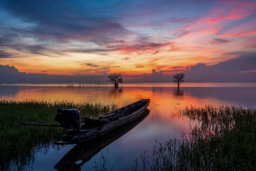 Naklejka na ściany i meble Fisherman boat and beautiful morning twilight.