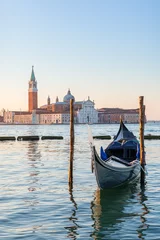 Venetian gondola with San Giorgio Maggiore church at background in Venice, Italy.
