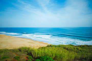 Fototapeta na wymiar huge sandy beach with big waves