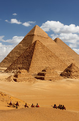 pyramids giza cairo in egypt with camel caravane panoramic scenic view - obrazy, fototapety, plakaty