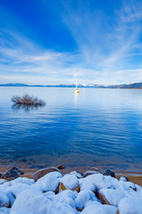 South Lake Tahoe with snow and blue water