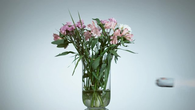 Vase with fresh flowers shattering in super slow motion, shot with Phantom Flex 4K