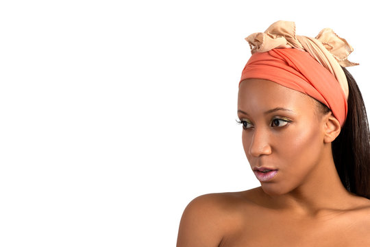 Studio shot of the young woman of the mulatta with  make up terracotta bandage on the head on white dackground