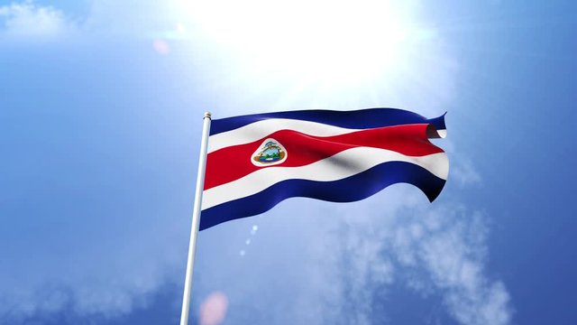 The national flag of Costa Rica waving in the wind on a sunny day.  Beautiful slow motion shot of the Costa Rican flag.