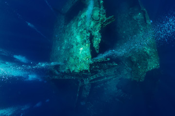 Beautiful underwater view with bubbles at shipwreck
