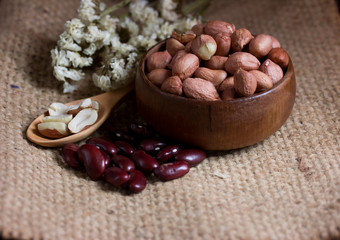 Peanut on Cup made of wood and spoon 
