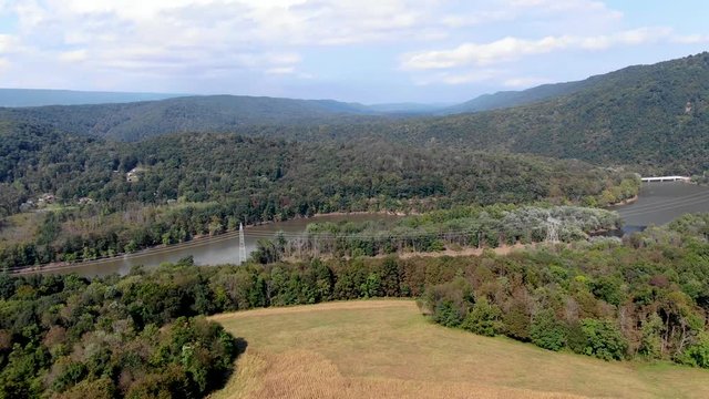 Aerial view of power lines stretching across the Juniata river near Saxton, PA, a starting point to explore the beauty of Raystown Lake Recreational Area