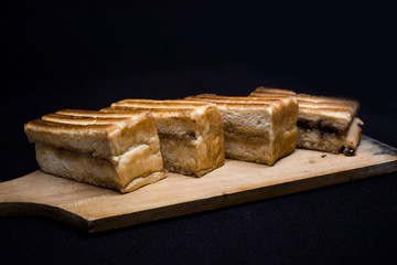 toast with chocolate sprinkles and tea to accompany relaxing time with a black background