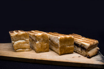 toast with chocolate sprinkles and tea to accompany relaxing time with a black background