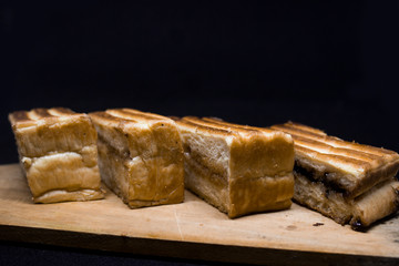 toast with chocolate sprinkles and tea to accompany relaxing time with a black background