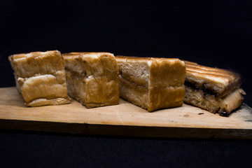 toast with chocolate sprinkles and tea to accompany relaxing time with a black background